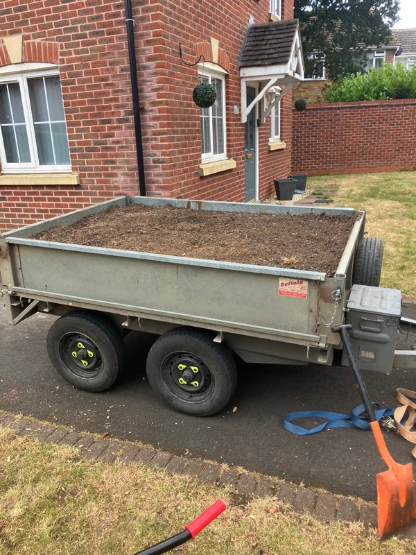 Trailer loaded with stump grindings